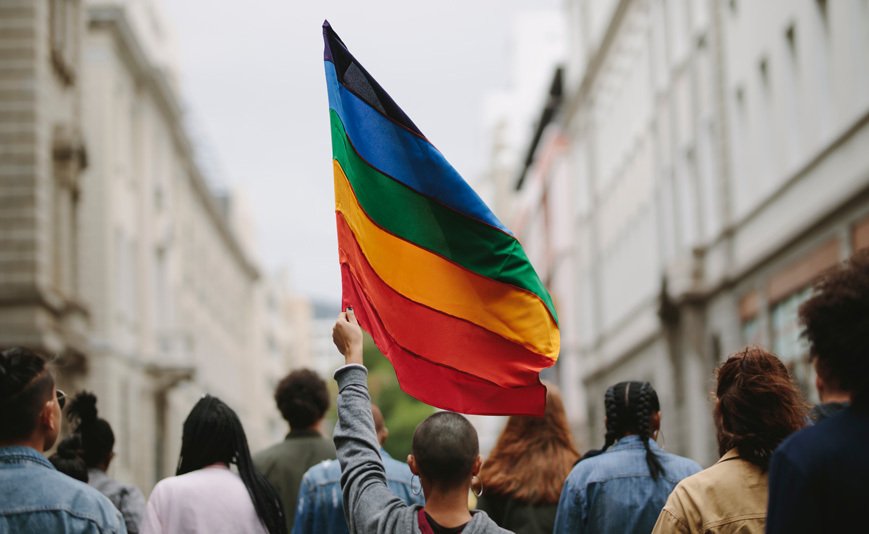 Person carrying pride flag